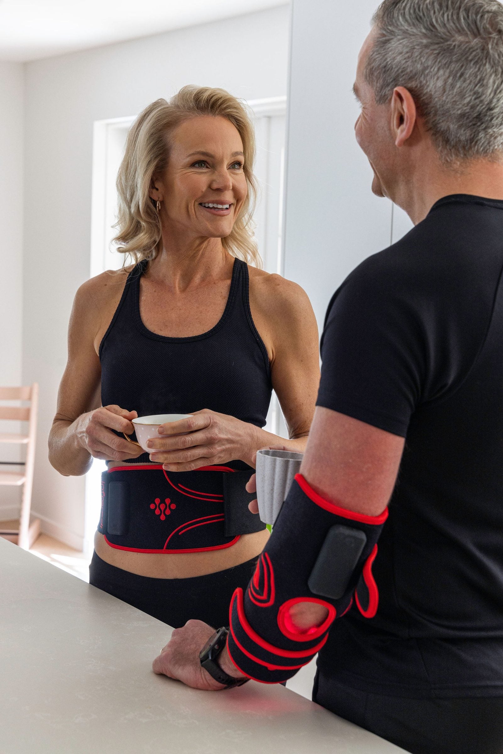 Couple wearing the Infraredi Body Wrap and Joint Wrap